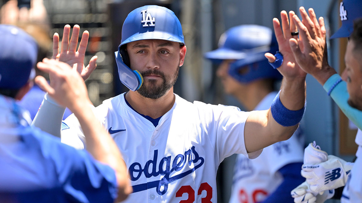 Los Angeles Dodgers left fielder Michael Conforto (23) celebrates after scoring a run against the Houston Astros during the second inning of the game at Dodger Stadium.