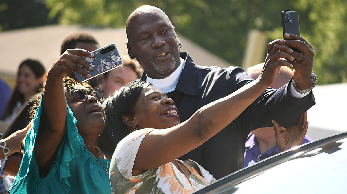 Michael Jordan takes a few photos with friends outside of The Michael Jordan Family Medical Clinic led by Novant Health. After taking part in a ribbon cutting ceremony for the new clinic opening off of Greenfield Street Tuesday May 7, 2024 in Wilmington, N.C.