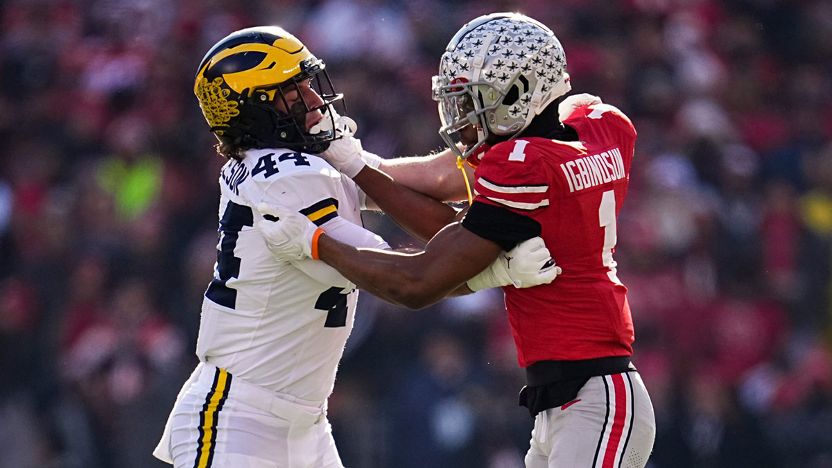 Ohio State Buckeyes cornerback Davison Igbinosun (1) locks up with Michigan Wolverines tight end Max Bredeson (44) during the NCAA football game at Ohio Stadium