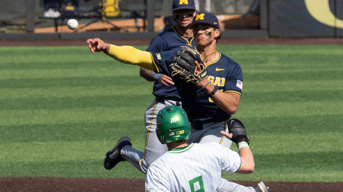 Michigan’s Mitch Voit gets the force out at second against Oregon’s Maddox Molony during the 4th inning.