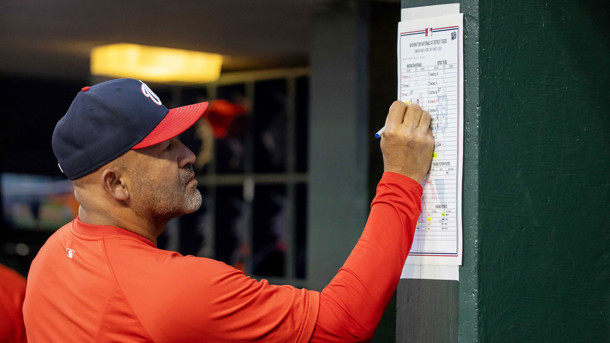 Washington Nationals bench coach Miguel Cairo (22) makes changes to his lineup in the eighth inning against the Detroit Tigers at Comerica Park.