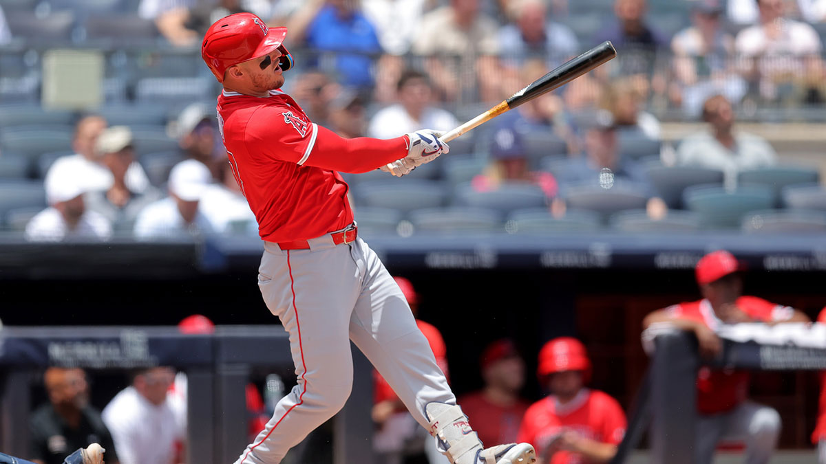 Jun 19, 2025; Bronx, New York, USA; Los Angeles Angels right fielder Mike Trout (27) follows through on a solo home run against the New York Yankees during the first inning at Yankee Stadium. 