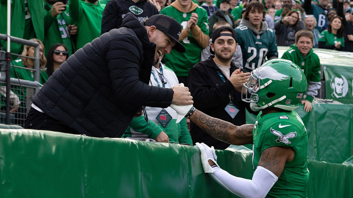 Dec 29, 2024; Philadelphia, Pennsylvania, USA; Philadelphia Eagles cornerback Darius Slay Jr. (2) gives a ball to MLB player Mike Trout after a fourth quarter fumble recovery against the Dallas Cowboys at Lincoln Financial Field.