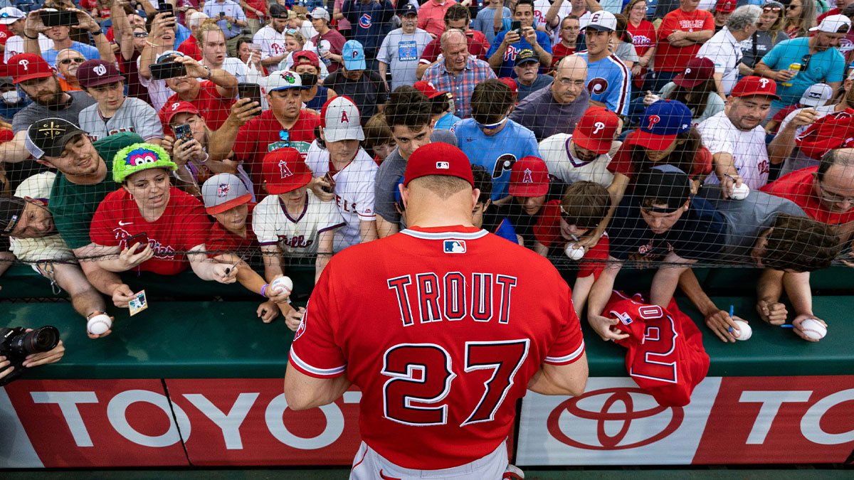 Los Angeles Angels center fielder Mike Trout (27) signs autographs for fans before action against the Philadelphia Phillies at Citizens Bank Park.