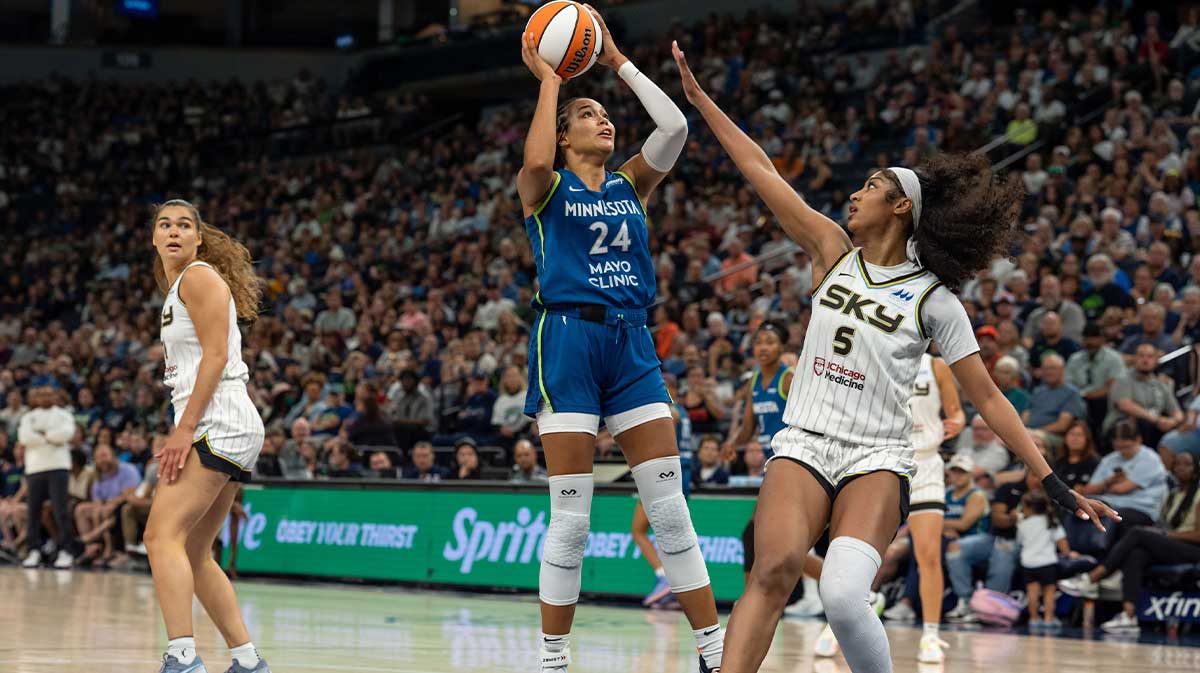 Minnesota Lynx forward Napheesa Collier (24) shoots over the defense of Chicago Sky forward Angel Reese (5) in the third quarter at Target Center.
