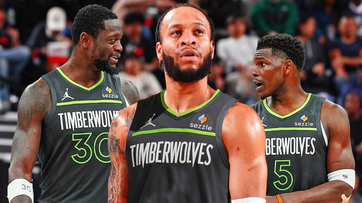 Amir Coffey wearing a Minnesota Timberwolves jersey in the middle, Anthony Edwards and Julius Randle around him
