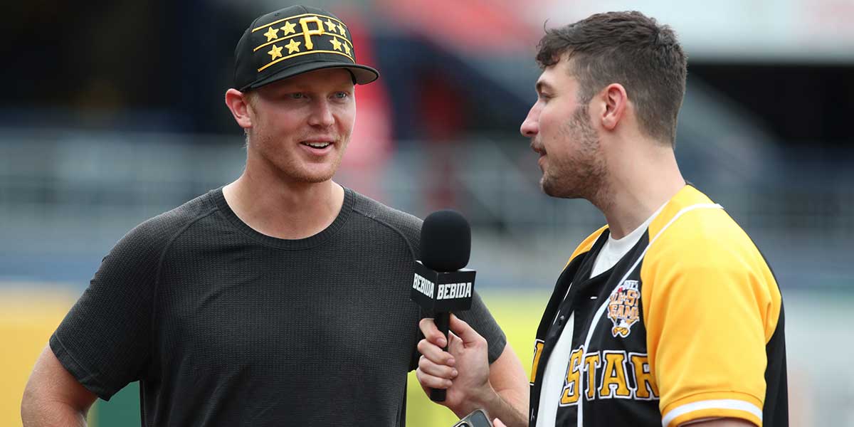 Pittsburgh Pirates pitcher Mitch Keller (23) is interviewed by Matthew Shaw (right) of social media channel Bebida Tailgate prior to the St. Louis Cardinals game at PNC Park.