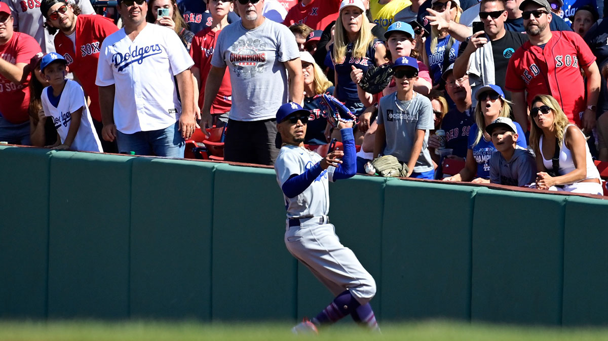 Los Angeles Dodgers second baseman Mookie Betts (50) catches a fly ball by Boston Red Sox right fielder Alex Verdugo (99) for an out during the fifth inning at Fenway Park.