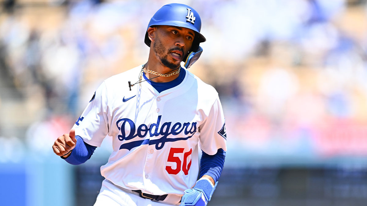 Los Angeles Dodgers shortstop Mookie Betts (50) rounds the bases after teammate designated hitter Shohei Ohtani (not pictured) hit a two-run home run against the Milwaukee Brewers during the third inning of the game at Dodger Stadium.