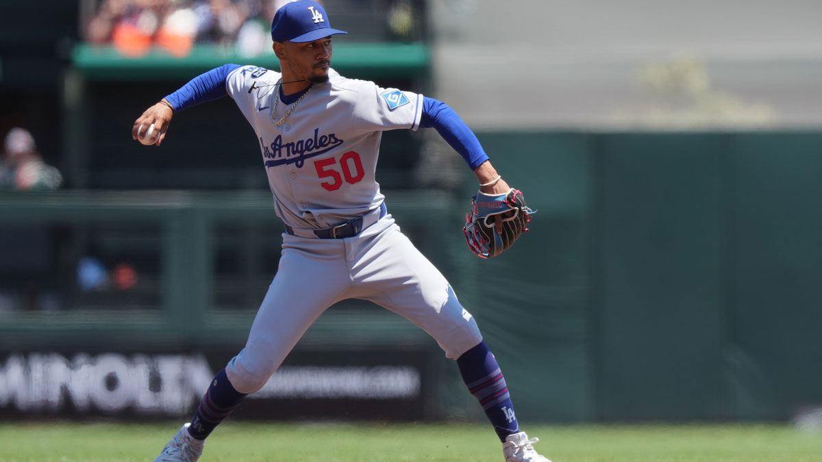 Los Angeles Dodgers shortstop Mookie Betts (50) throws the ball to first base during the second inning against the San Francisco Giants at Oracle Park.