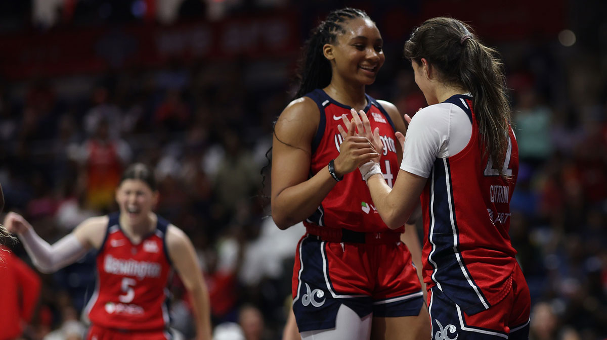 Washington Mystics guard Sonia Citron (22) celebrates its Mystics forward Kiki Iriafen (44) after scoring while being fouled against the Chicago Sky in the second half at CareFirst Arena.