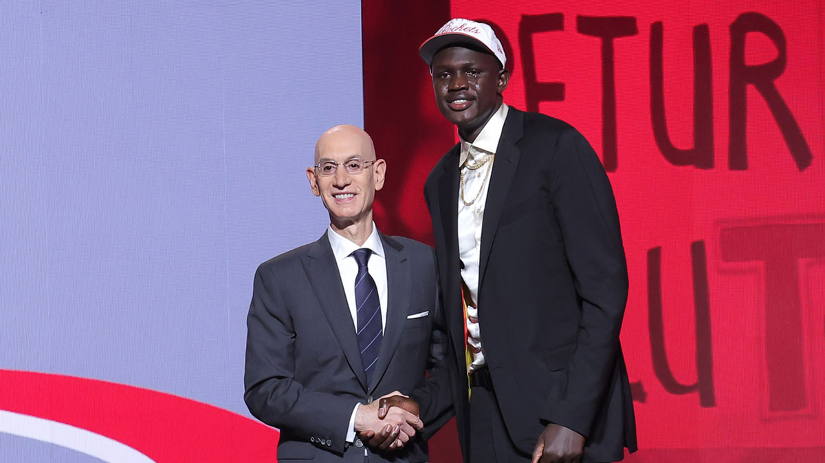 Khaman Maluach stands with NBA commissioner Adam Silver after being selected as the tenth pick by the Houston Rockets in the first round of the 2025 NBA Draft at Barclays Center.