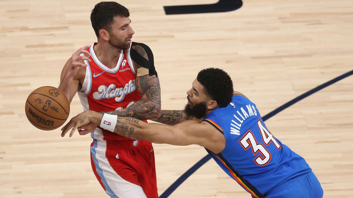 Oklahoma City Thunder forward Kenrich Williams (34) knocks the ball away from Memphis Grizzlies guard John Konchar (46) during the first quarter during the first quarter during game four for the first round of the 2024 NBA Playoffs at FedExForum.