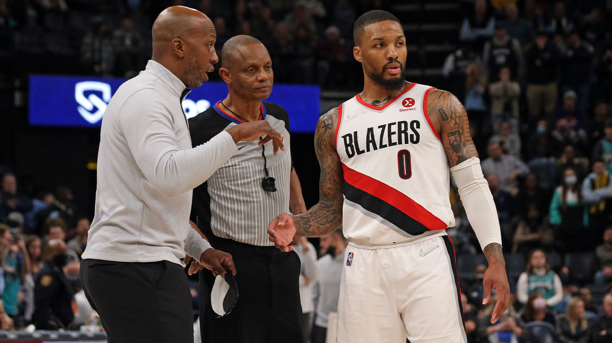 Portland Trail Blazers head coach Chauncey Billups talks with Portland Trail Blazers guard Damian Lillard (0) after a foul call during the fourth quarter against the Memphis Grizzles at FedExForum.