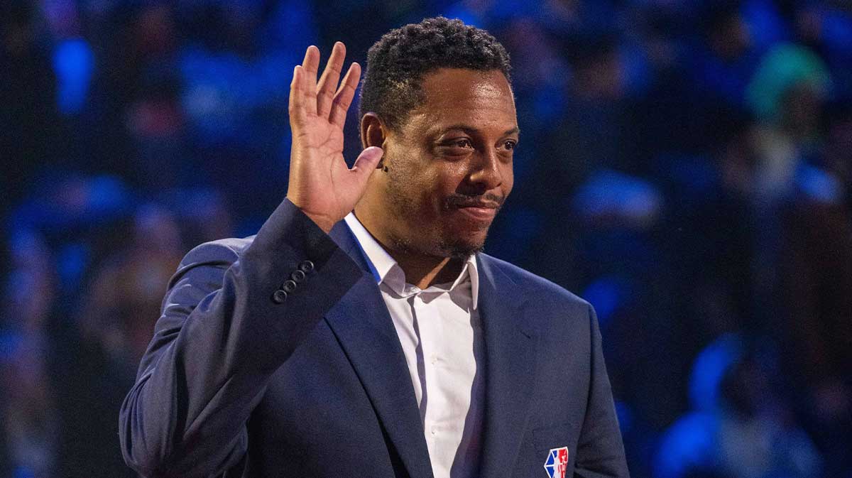 Paul Pierce is honored for being selected to the NBA 75th Anniversary Team during halftime in the 2022 NBA All-Star Game at Rocket Mortgage FieldHouse with Lakers' Deandre Ayton in the background