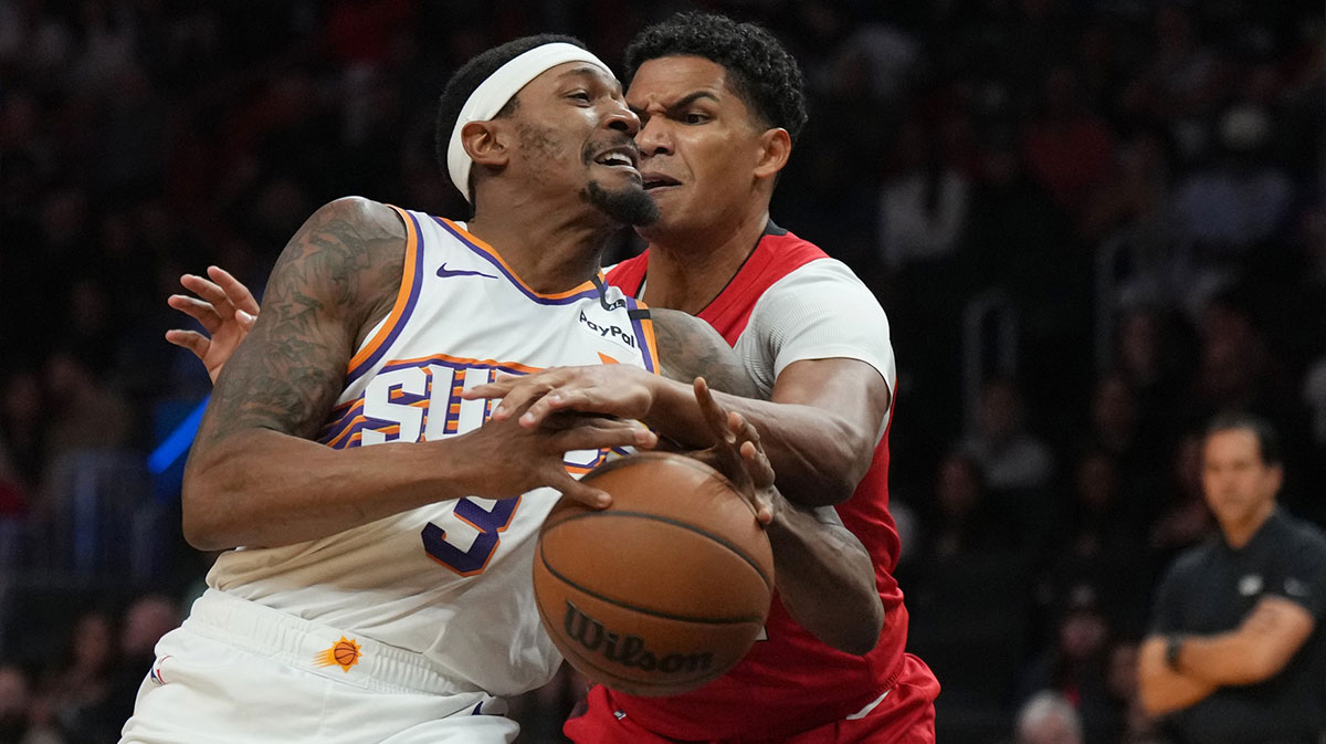 Phoenix Suns guard Bradley Beal (3) drives to the basket against Miami Heat guard Dru Smith (12) during the first half at Kaseya Center.