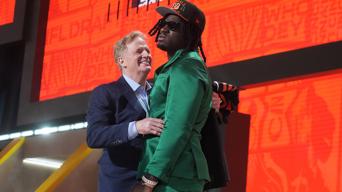 NFL commissioner Roger Goodell with Texas A&M Aggies defensive end Shemar Stewart after her is selected by the Cincinnati Bengals as the number seventeen pick in the first round of the 2025 NFL Draft at Lambeau Field.