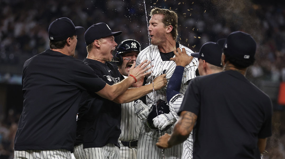 New York Yankees third baseman Ryan McMahon (19) celebrates with his teammates after hitting a game winning RBI single in the eleventh inning to defeat the Tampa Bay Rays 5-4 at Yankee Stadium.