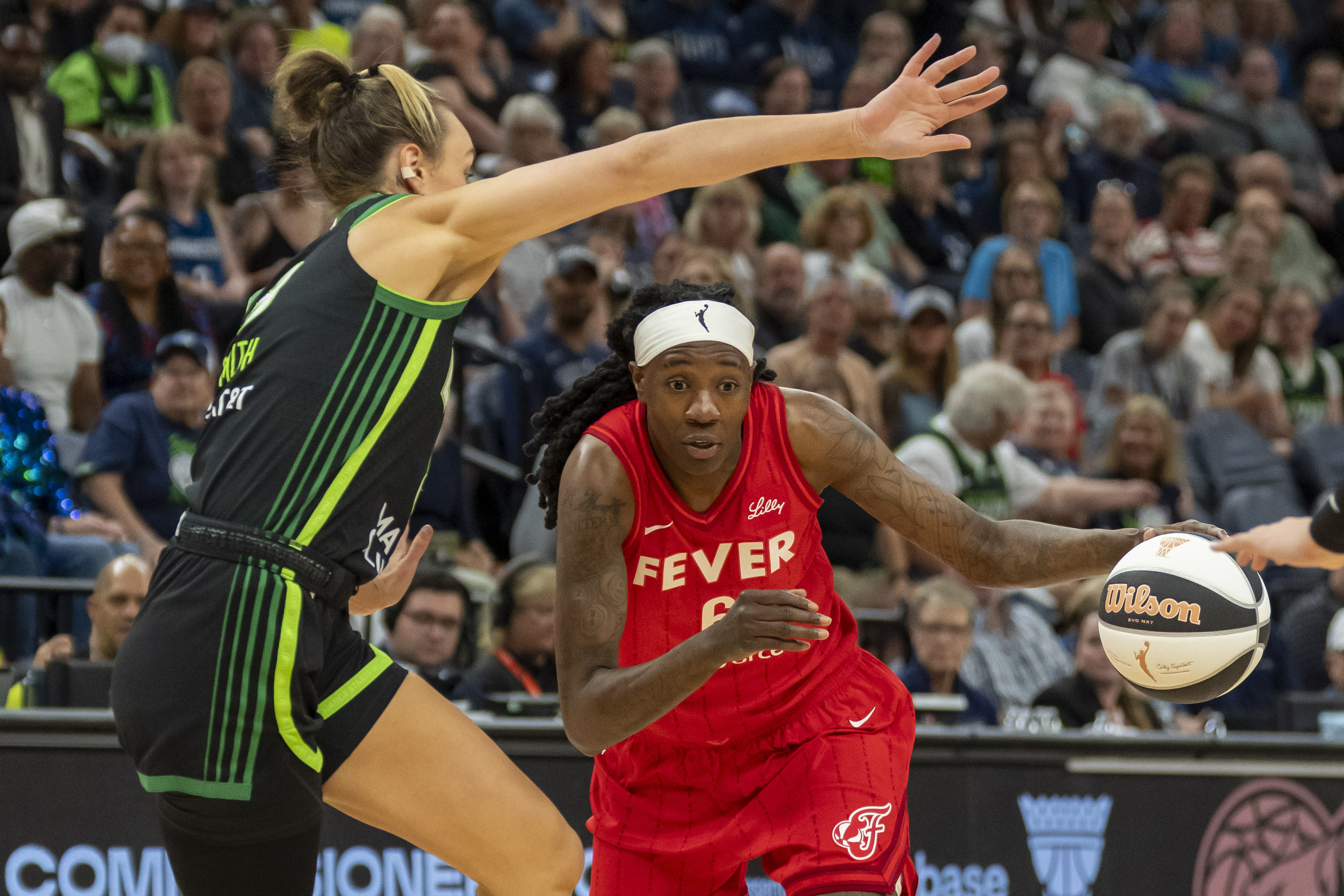 Indiana Fever forward Natasha Howard (6) drives to the basket past Minnesota Lynx forward Alanna Smith (8) in the first half during the Commissioner's Cup final at Target Center.