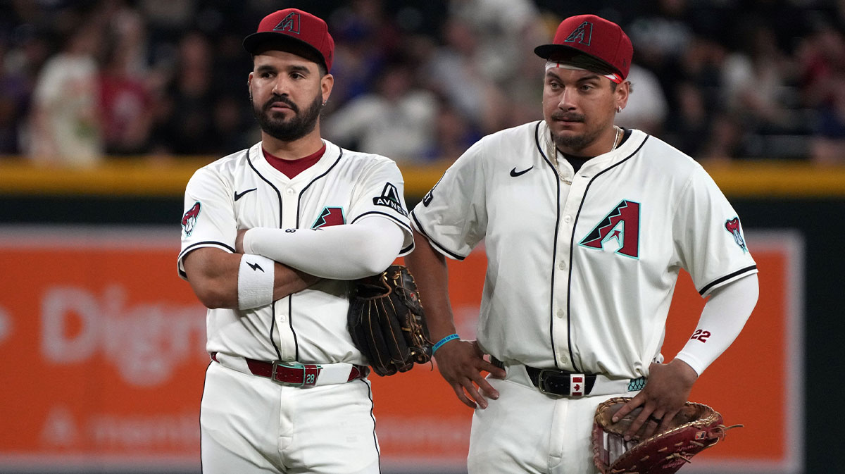 Jun 9, 2025; Phoenix, Arizona, USA; Arizona Diamondbacks third base Eugenio Suarez (28) and first base Josh Naylor (22) talk in the ninth inning against the Seattle Mariners at Chase Field. 