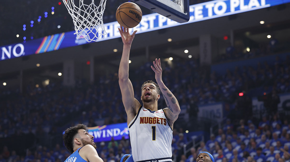 Denver Nuggets forward Michael Porter Jr. (1) shoots beside Oklahoma City Thunder forward Chet Holmgren (7) in the first quarter during game seven of the second round for the 2025 NBA Playoffs at Paycom Center. Michael Porter Jr. was traded to the Nets from the Nuggets in exchange for Cam Johnson in NBA Free Agency.