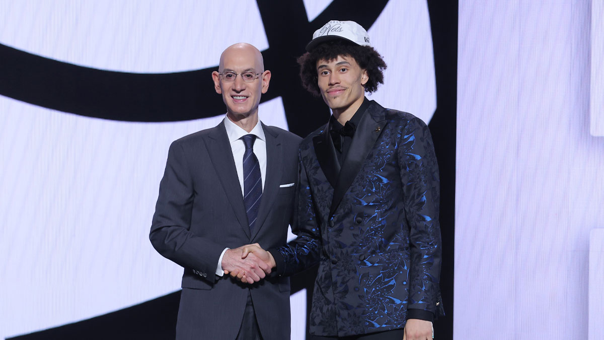Nolan Traore stands with NBA commissioner Adam Silver after being selected as the 19th pick by the Brooklyn Nets in the first round of the 2025 NBA Draft at Barclays Center.