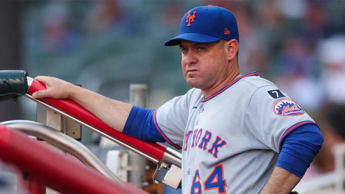 New York Mets manager Carlos Mendoza (64) in the dugout before a game against the Atlanta Braves at Truist Park.