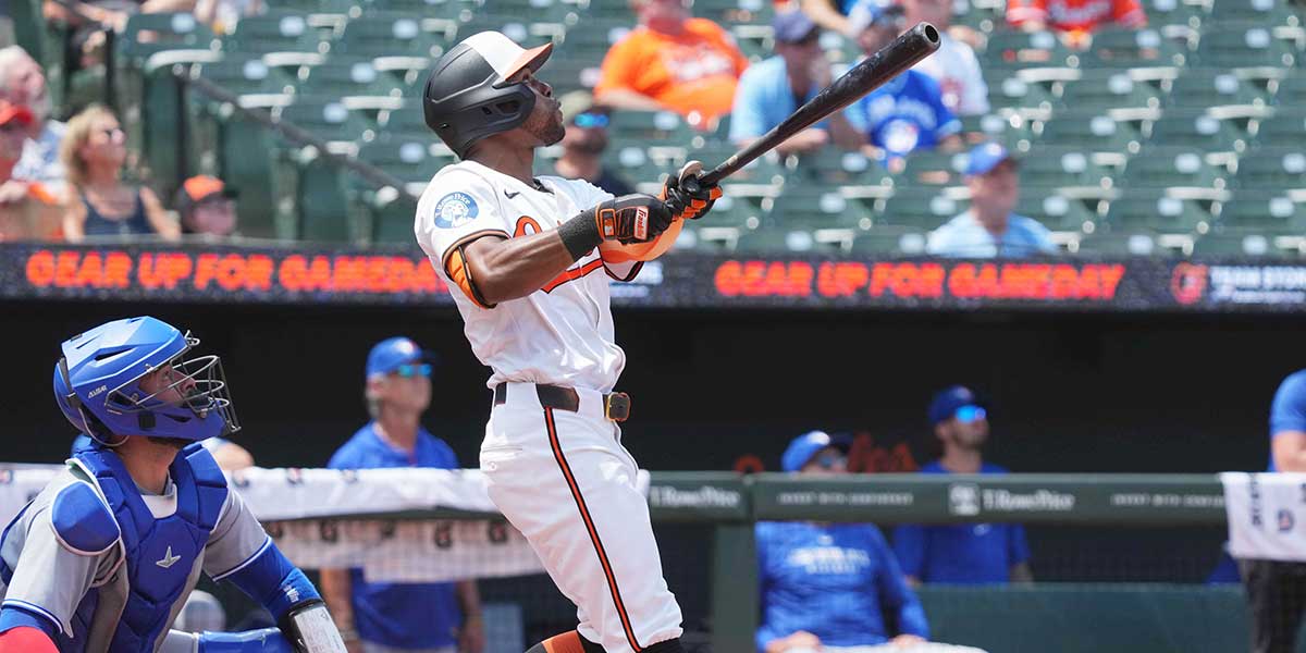 Baltimore Orioles outfielder Cedric Mullins (31) drives in a run with a sacrifice fly ball during the third inning against the Toronto Blue Jays at Oriole Park at Camden Yards.