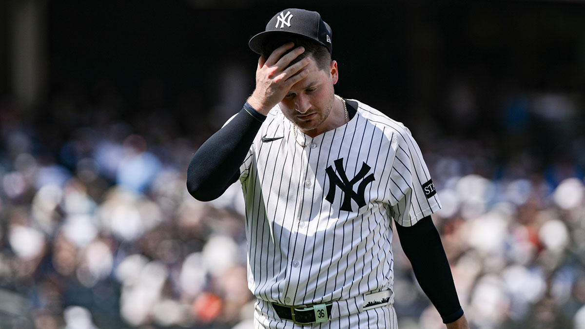 New York Yankees pitcher Clarke Schmidt (36) reacts to the hot weather during the fifth inning against the Baltimore Orioles at Yankee Stadium.
