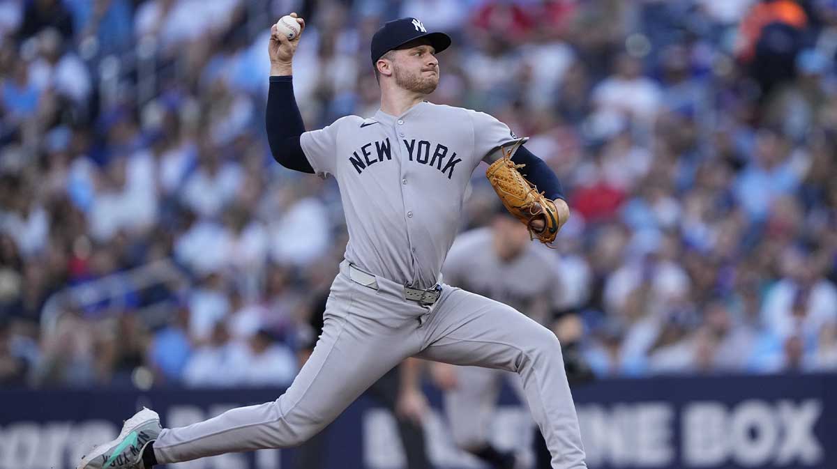 New York Yankees starting pitcher Clarke Schmidt (36) pitches to the Toronto Blue Jays during the second inning at Rogers Centre. Cruz