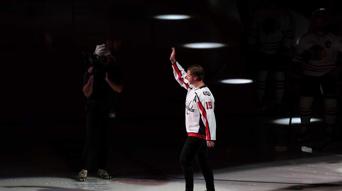 Washington Capitals center Nicklas Backstrom (19) waves to fans in the stands during a 2018 Stanley Cup Champions ceremonial puck drop prior to the Capitals game against the Chicago Blackhawks at Capital One Arena.