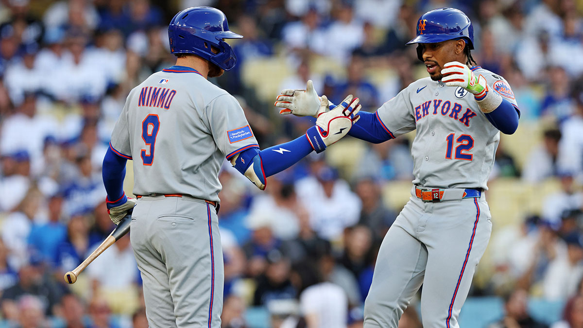 Jun 2, 2025; Los Angeles, California, USA; New York Mets shortstop Francisco Lindor (12) celebrates with New York Mets outfielder Brandon Nimmo (9) during the first inning against the Los Angeles Dodgers during the first inning against the New York Mets at Dodger Stadium. Mandatory Credit: Jason Parkhurst-Imagn Images