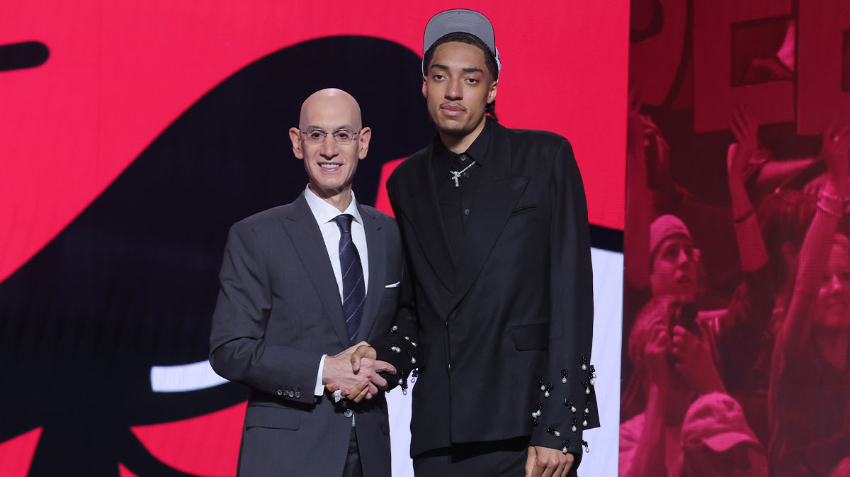 Noa Essengue stands with NBA commissioner Adam Silver after being selected as the 12th pick by the Chicago Bulls in the first round of the 2025 NBA Draft at Barclays Center.