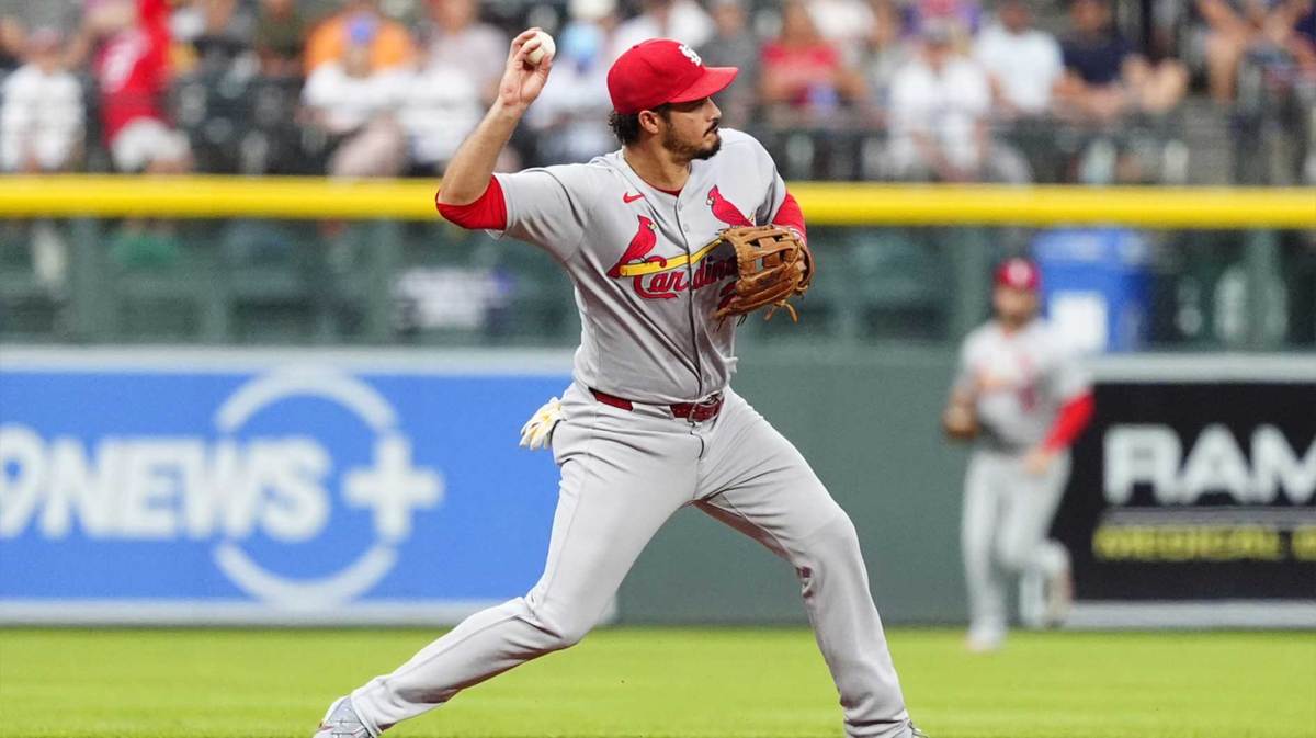 St. Louis Cardinals third baseman Nolan Arenado (28) fields the ball in the first inning against the Colorado Rockies at Coors Field.