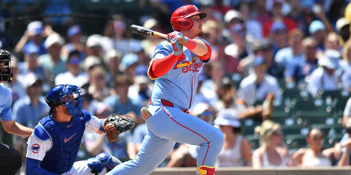 St. Louis Cardinals designated hitter Nolan Gorman (16) hits a home run during the fourth inning against the Chicago Cubs at Wrigley Field.