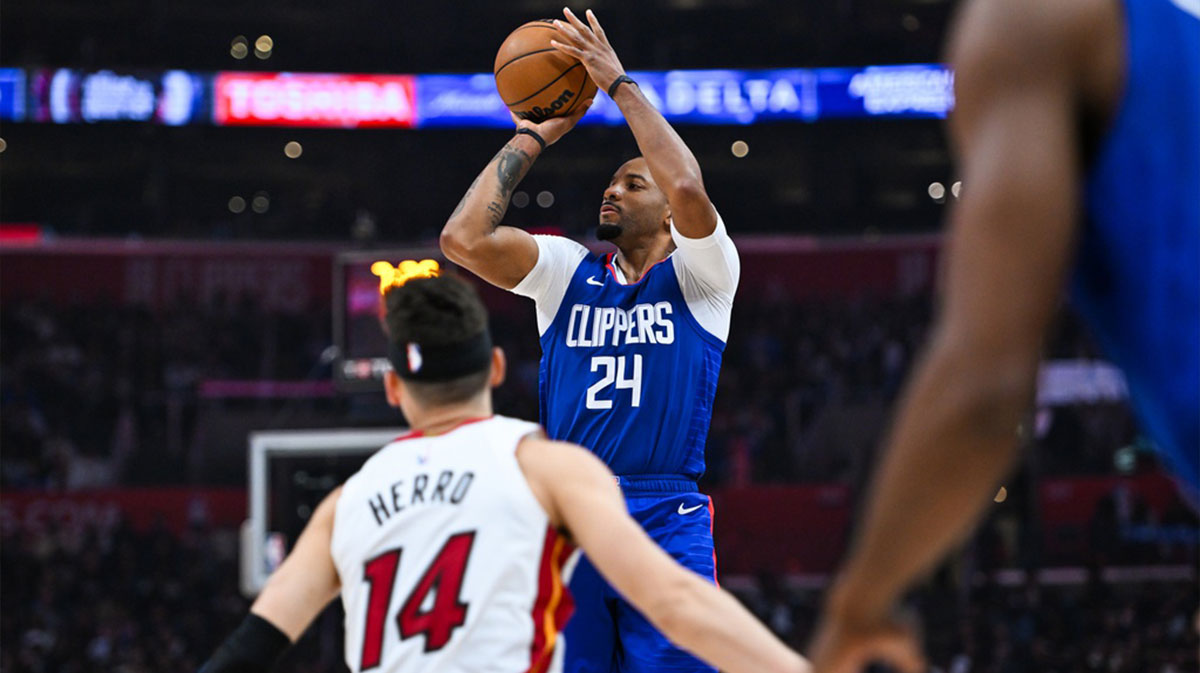 Los Angeles Clippers guard Norman Powell (24) shoots against Miami Heat guard Tyler Herro (14) during the second quarter at Crypto.com Arena.