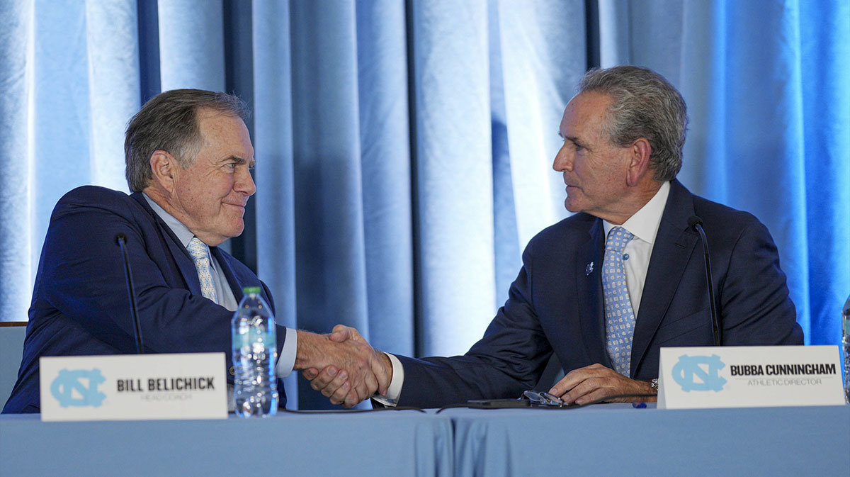 North Carolina Tar Heels new head coach Bill Belichick shakes hands with athletic director Bubba Cunningham at Loudermilk Center for Excellence.