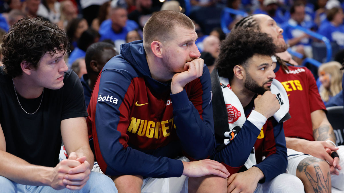 Nuggets center Nikola Jokic (15) watches the game from the bench in the fourth quarter against the Oklahoma City Thunder in game seven of the second round for the 2025 NBA Playoffs at Paycom Center with Serbia basketball in the background