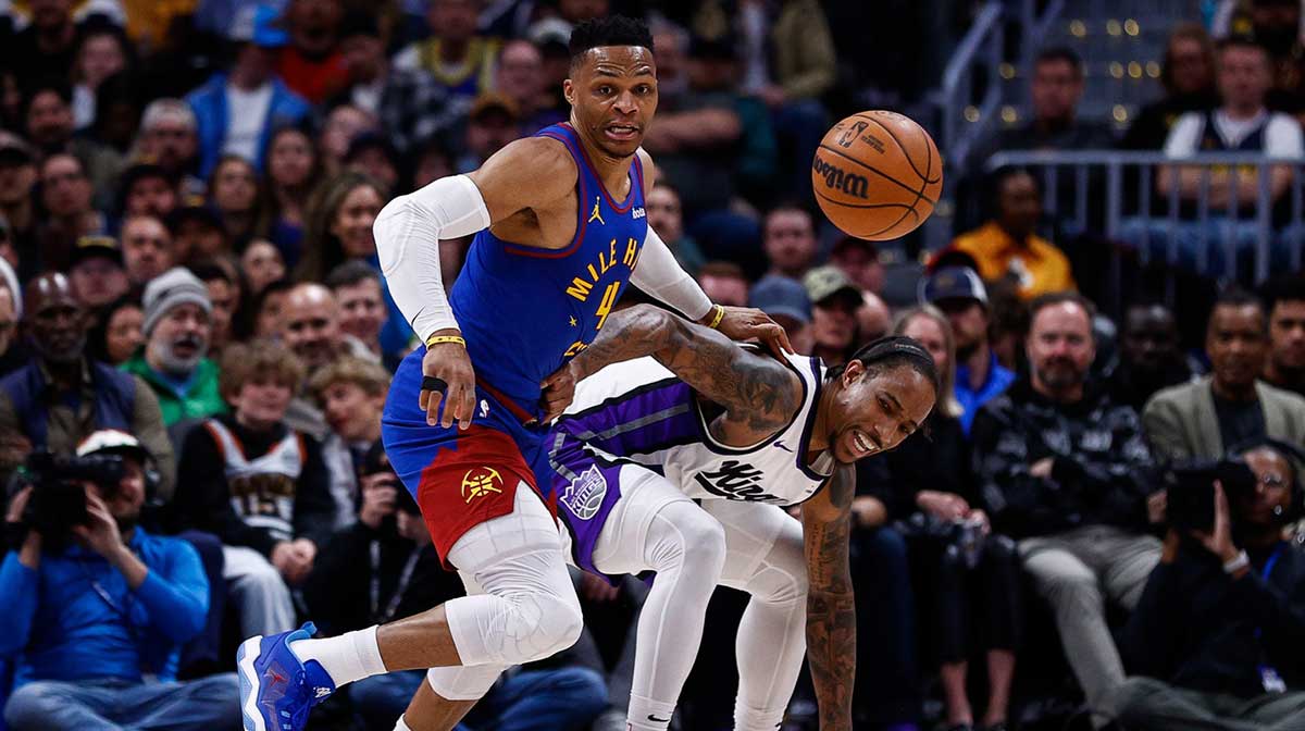 Nuggets guard Russell Westbrook (4) strips the ball away from Sacramento Kings forward DeMar DeRozan (10) in the second quarter at Ball Arena with Kings' Dennis Schroder in the background