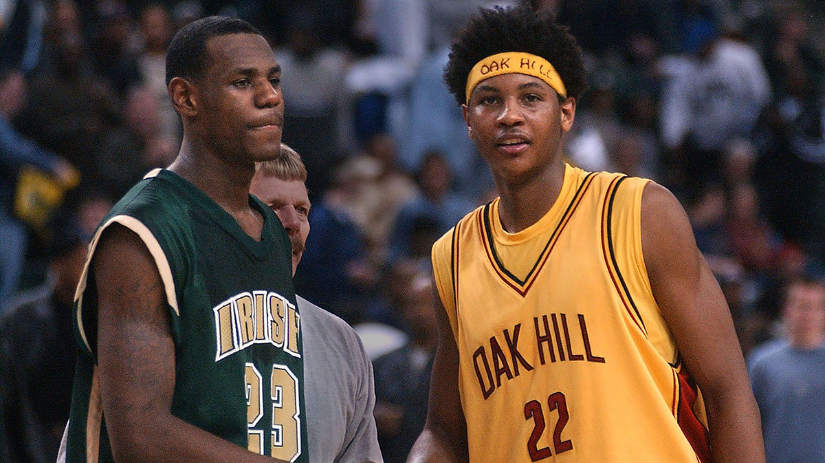 Cavs' LeBron James and Oak Hill senior Nuggets' Carmelo Anthony meet at half court after the Irish's 72-66 loss. James had 36 points in the game