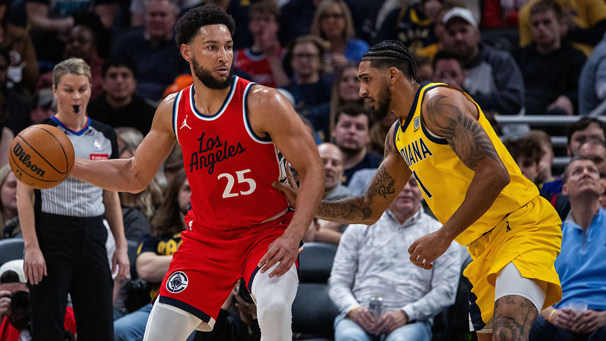 LA Clippers guard Ben Simmons (25) dribbles the ball while Indiana Pacers forward Obi Toppin (1) defends in the second half at Gainbridge Fieldhouse.