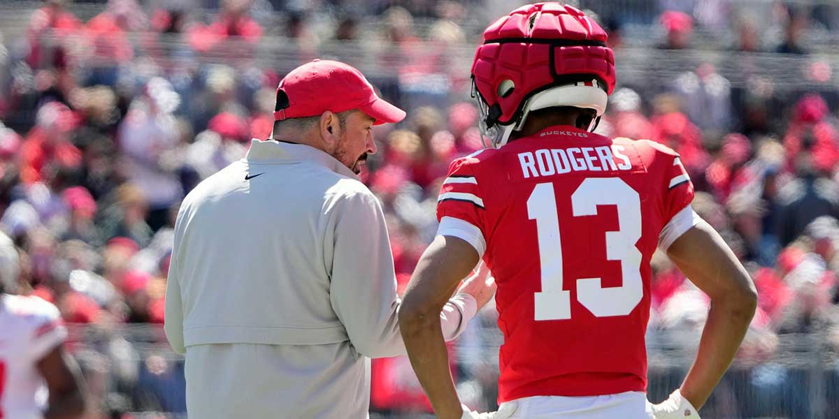 Ohio State Buckeye head coach Ryan Day talks to Bryson Rodgers (13) after a play against team Gray in the 1st half during the spring game at Ohio Stadium on April 12, 2025.