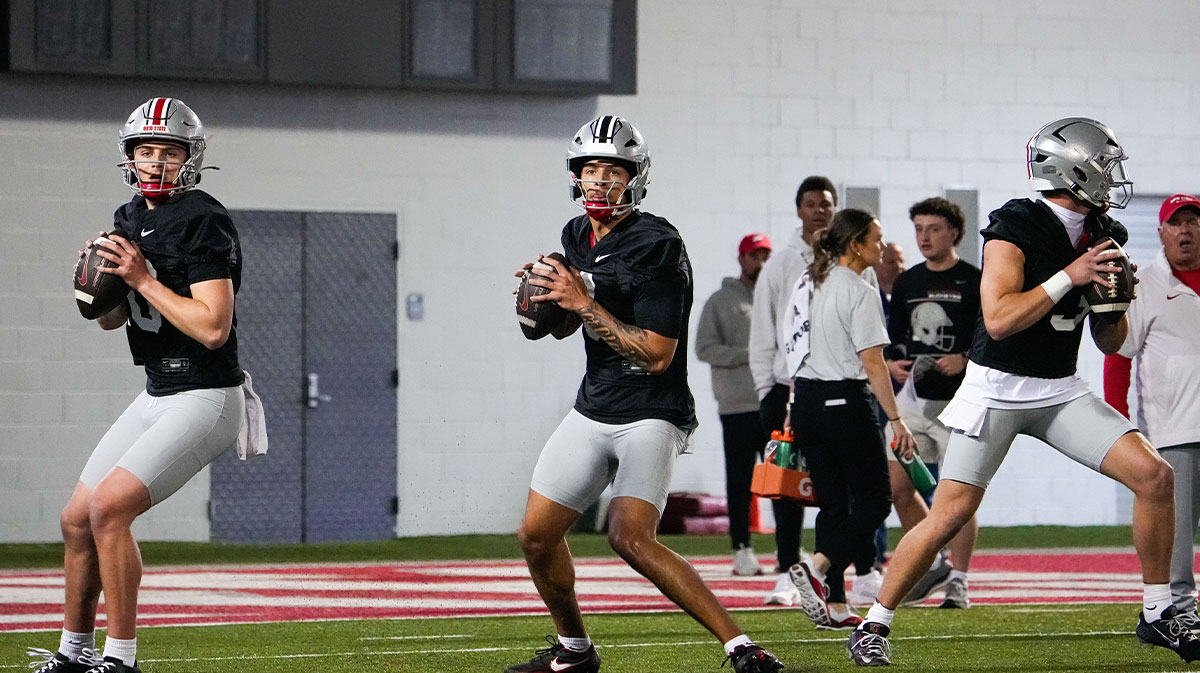 Ohio State Buckeyes quarterbacks Julian Sayin (10), Tavien St. Clair (9) and Lincoln Kienholz (3) look to throw during spring football practice at the Woody Hayes Athletic Center