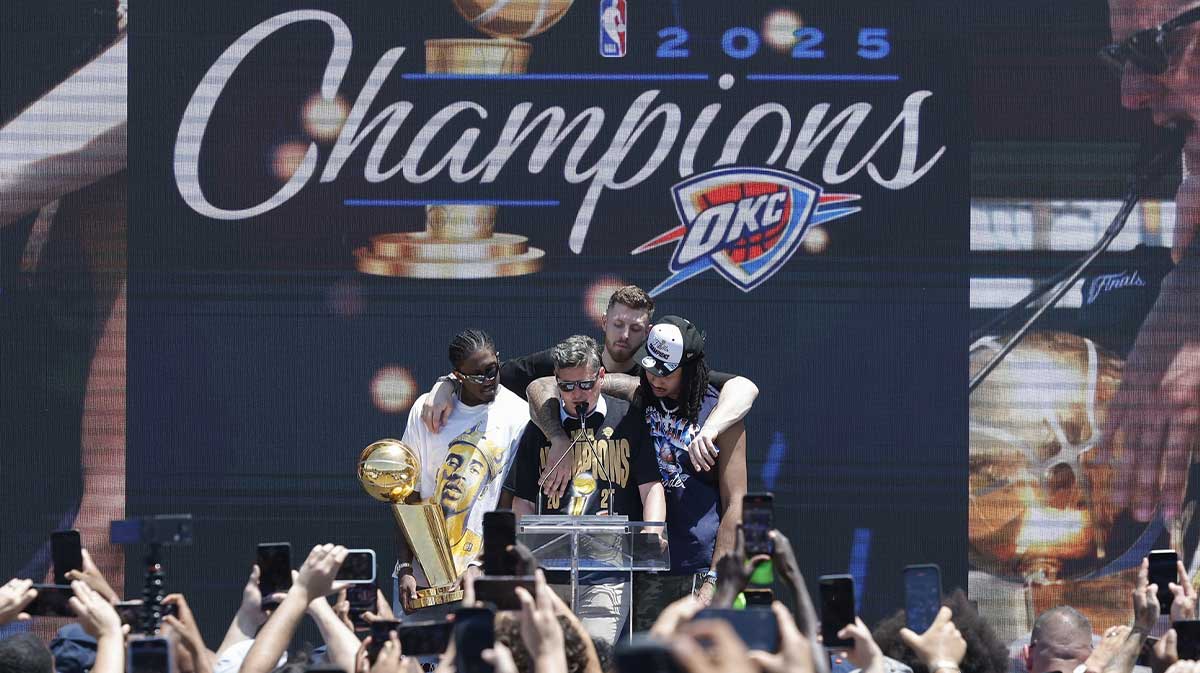 Thunder forward Jalen Williams, left, Oklahoma City Thunder center Isaiah Hartenstein, back, and Oklahoma City Thunder forward Jaylin Williams, right, gather around Oklahoma City Mayor David Holt during the Oklahoma City Thunder Champions parade closing ceremony at Scissortail Park