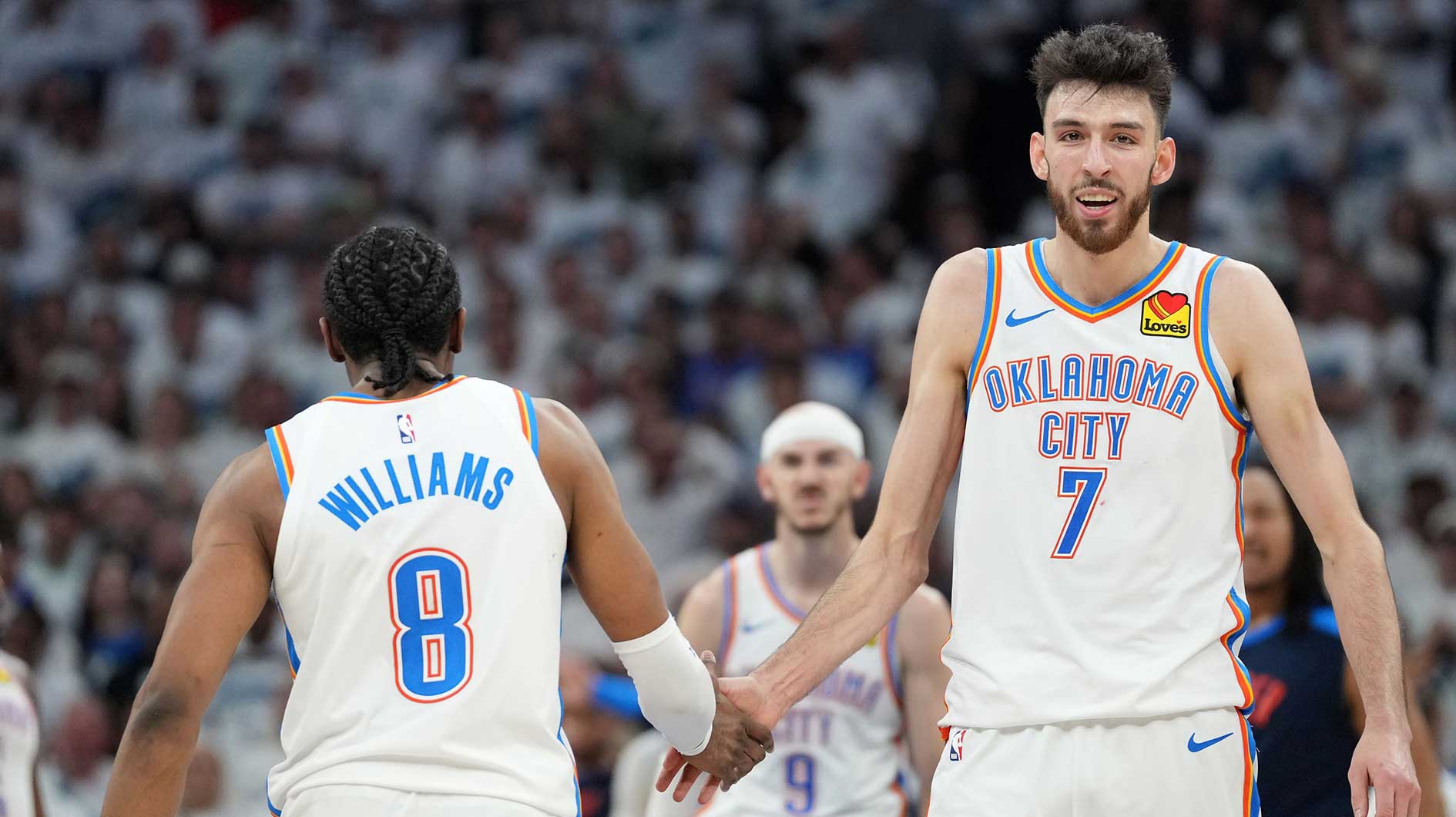 Oklahoma City Thunder forward Chet Holmgren (7) reacts with forward Jalen Williams (8) in the second half during game four of the western conference finals for the 2025 NBA Playoffs at Target Center.