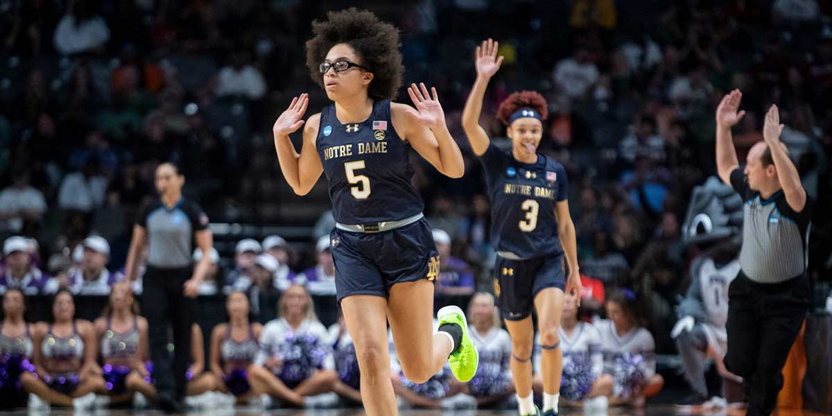 TCU women's basketball guard Olivia Miles celebrates a three-pointer as TCU Horned Frogs face off with Notre Dame Fighting Irish during the Sweet 16 at Legacy Arena in Birmingham, Ala.
