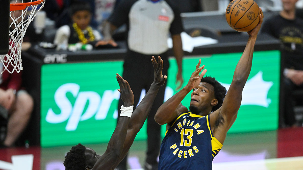 Indiana Pacers center James Wiseman (13) shoots beside Cleveland Cavaliers forward JT Thor (15) in the fourth quarter at Rocket Mortgage FieldHouse.