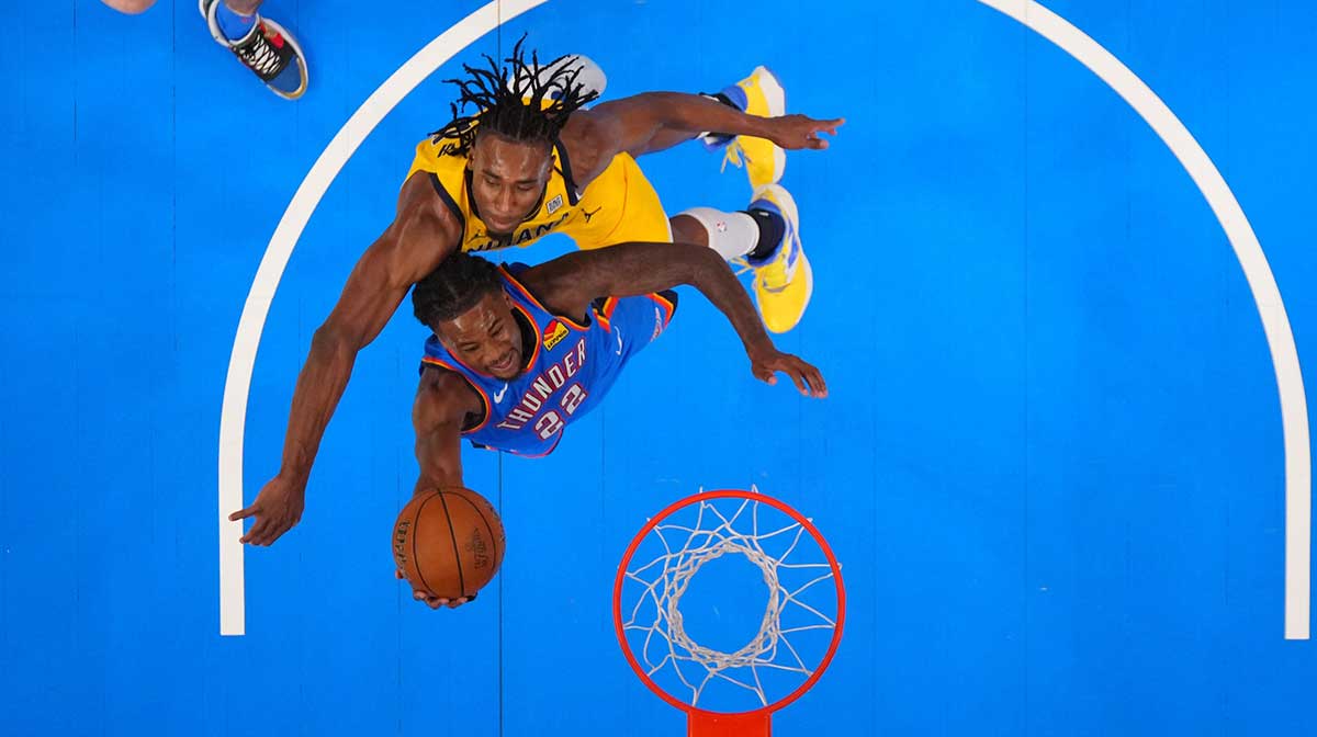 Oklahoma City Thunder guard Cason Wallace (22) shoots against Indiana Pacers forward Aaron Nesmith (23) during the second half during game seven of the 2025 NBA Finals at Paycom Center.