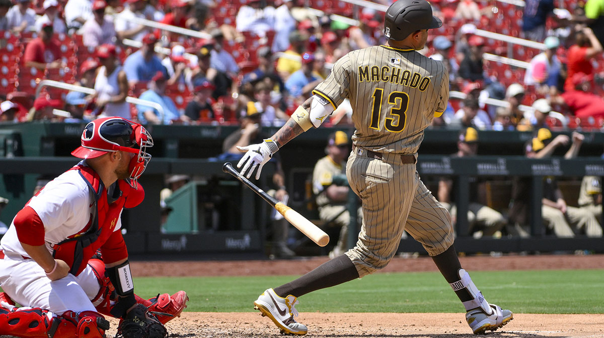 San Diego Padres third baseman Manny Machado (13) hits a two run double against the St. Louis Cardinals during the fourth inning at Busch Stadium.