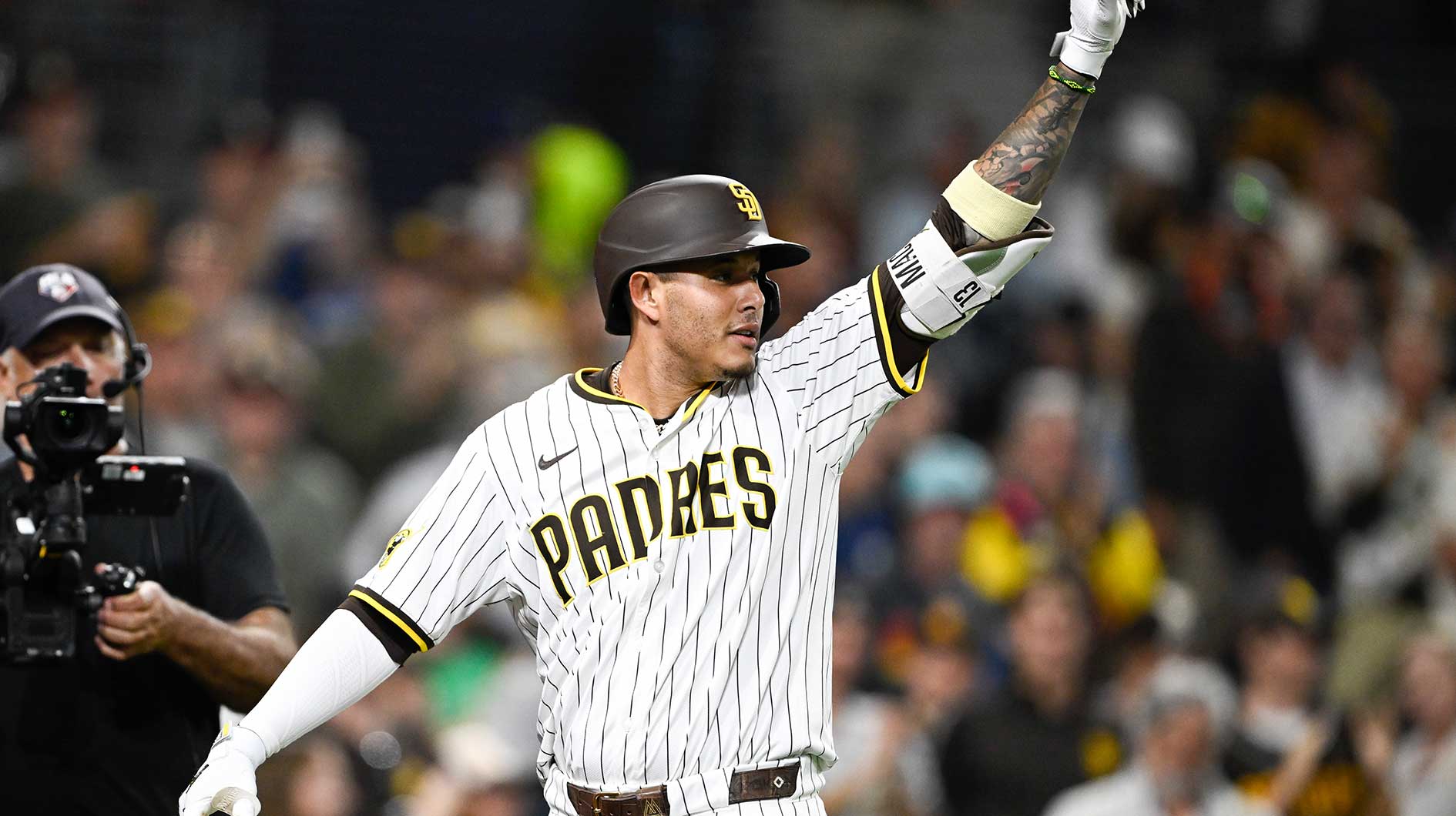 San Diego Padres third baseman Manny Machado (13) celebrates after hitting a solo home run during the eighth inning against the Arizona Diamondbacks at Petco Park.